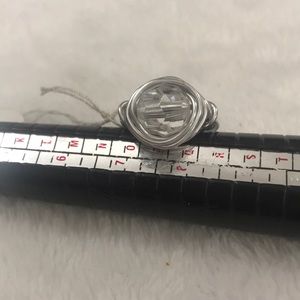 Silver wired ring with clear bead interiorly